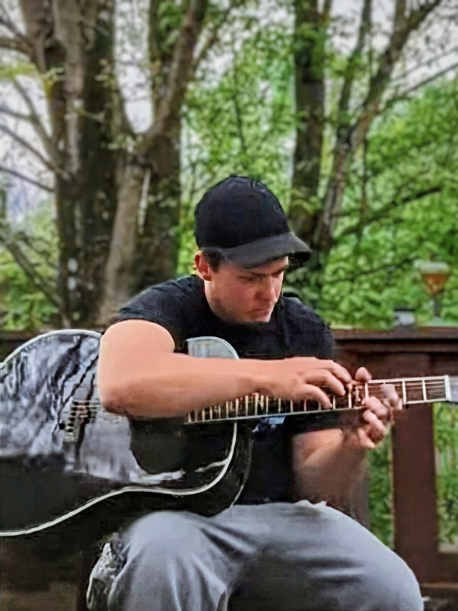 Travis Elkins – Fingerstyle Guitarist | Autism Awareness Advocate